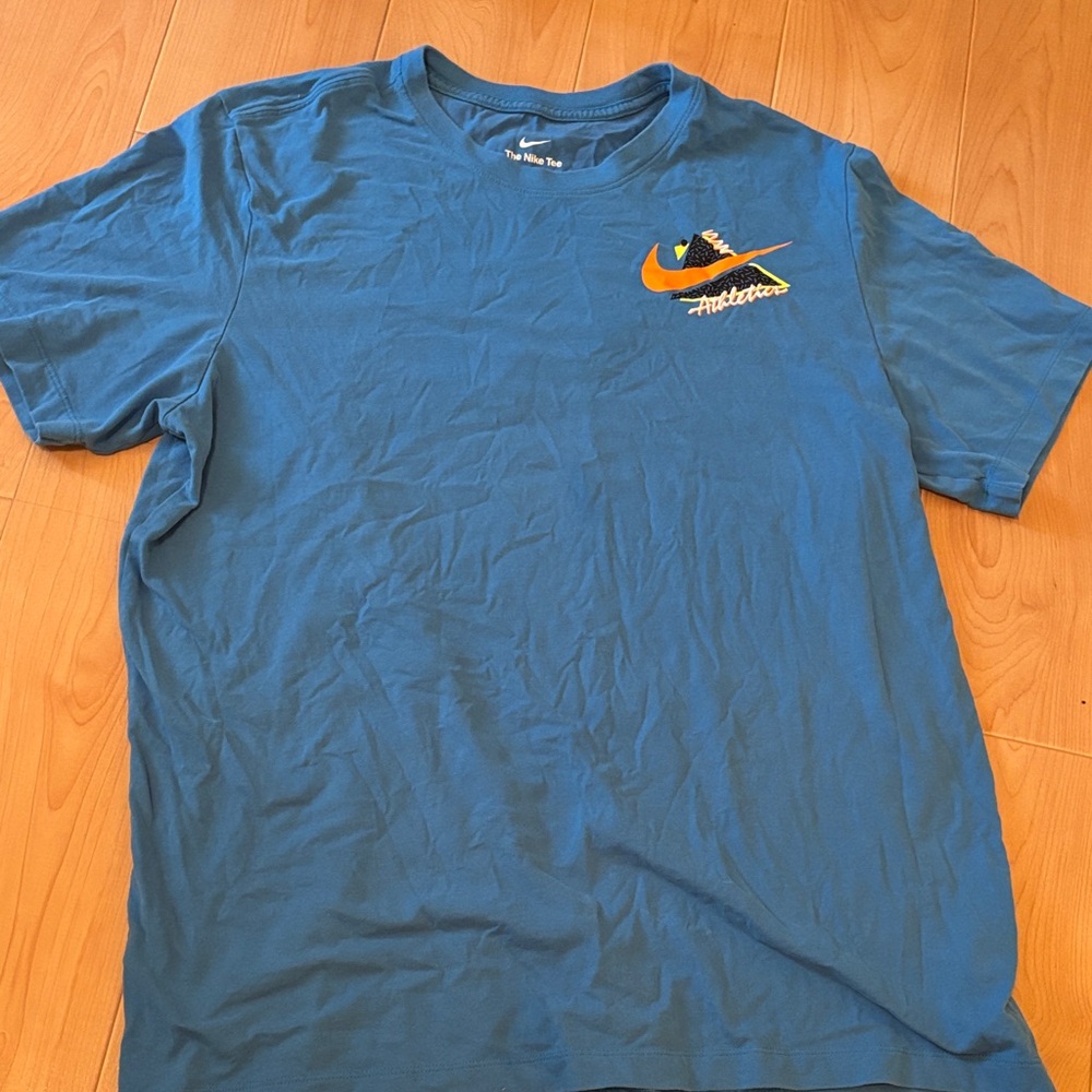 Nike Blue Short-Sleeve Tee with Orange Swoosh Graphic